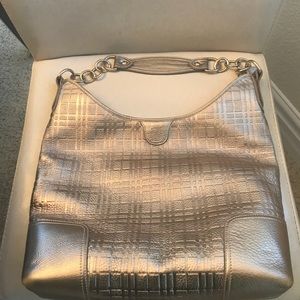 Burberry silver tote with metal straps
